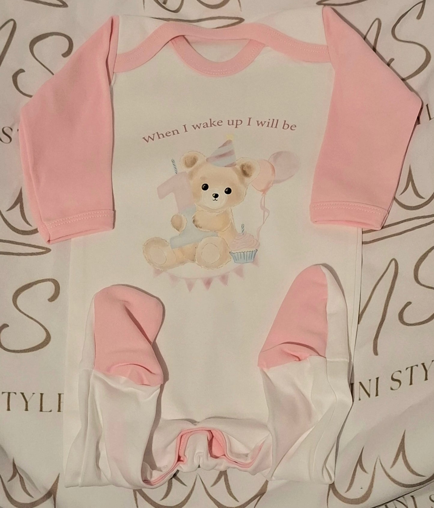 Pink 1st birthday sleepsuit