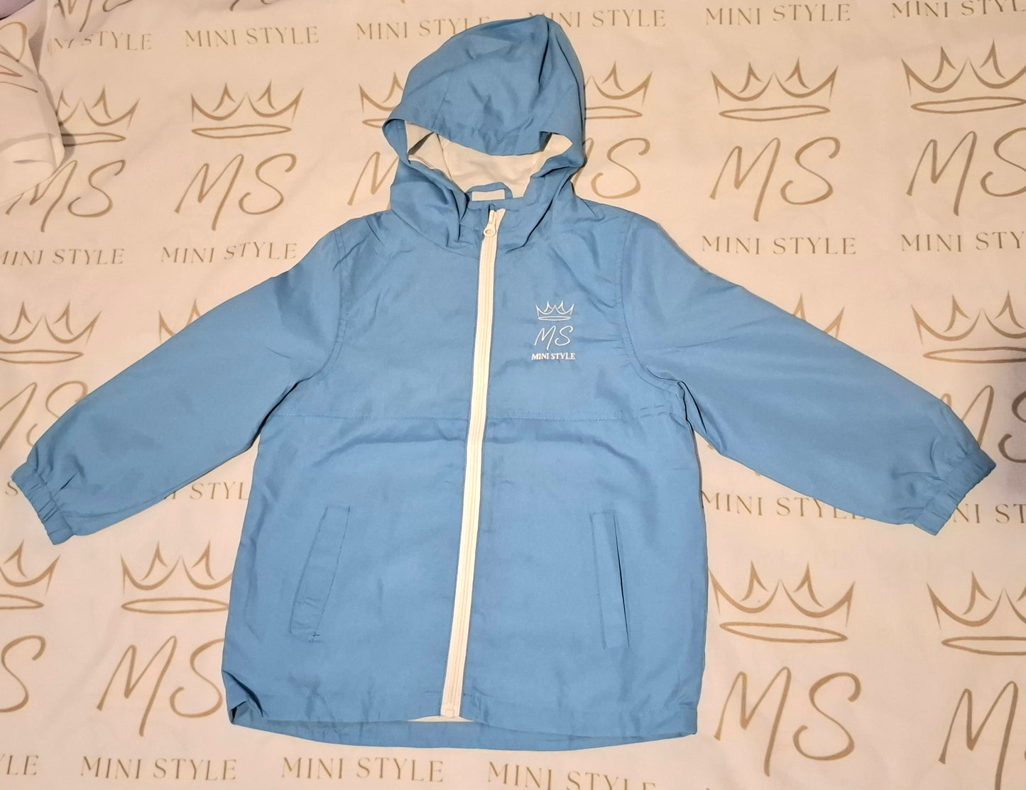 Blue shower proof windbreaker jacket