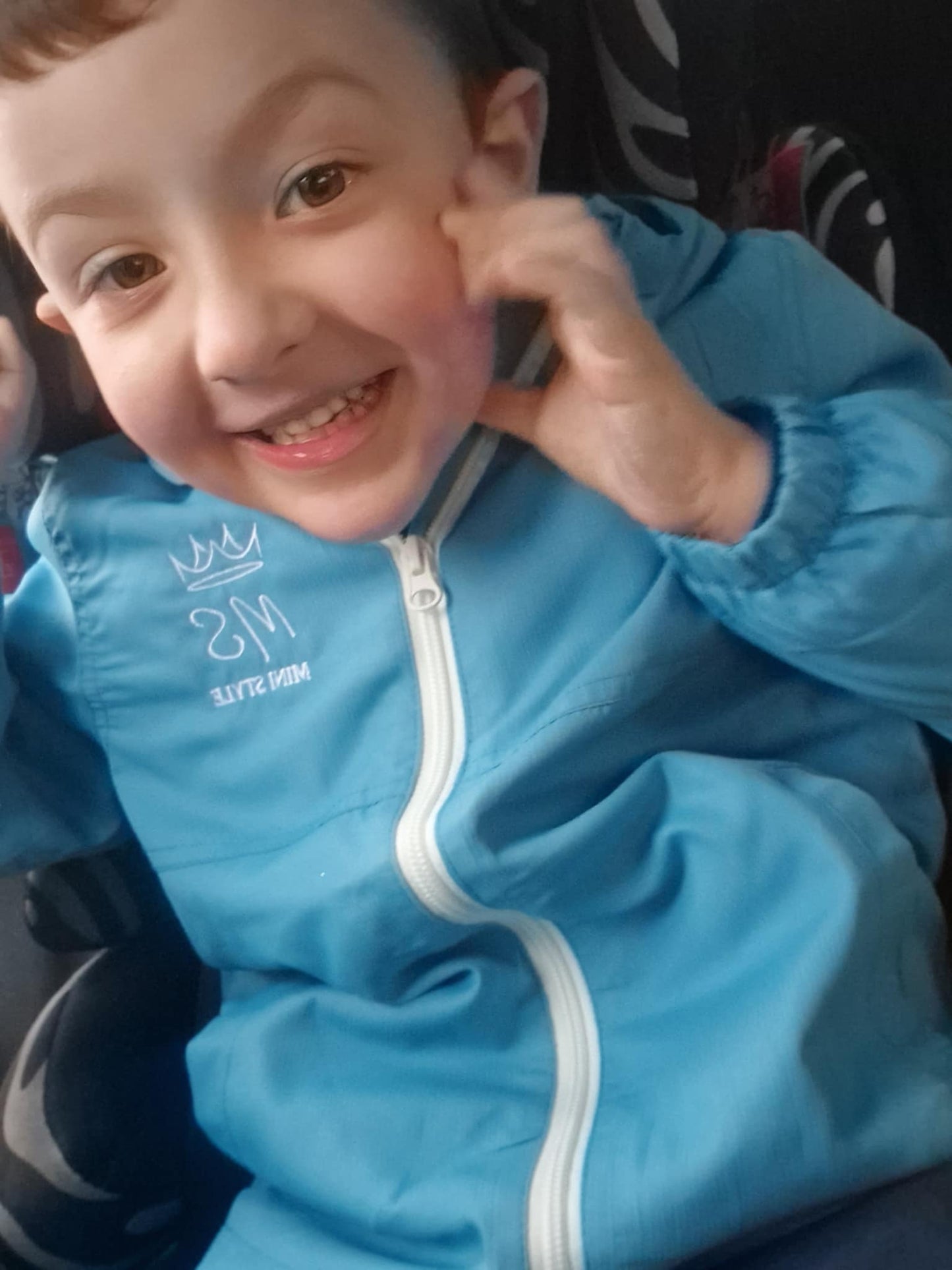 Blue shower proof windbreaker jacket