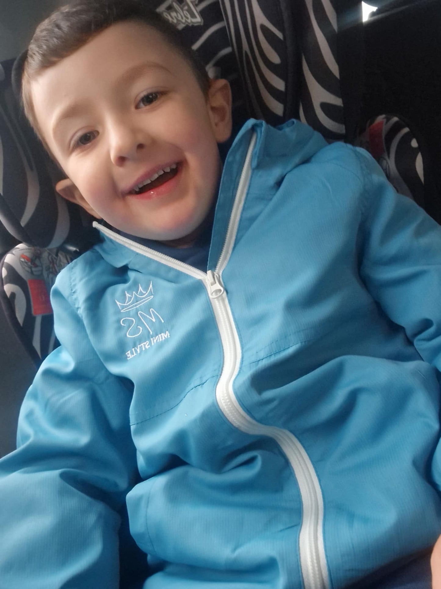 Blue shower proof windbreaker jacket